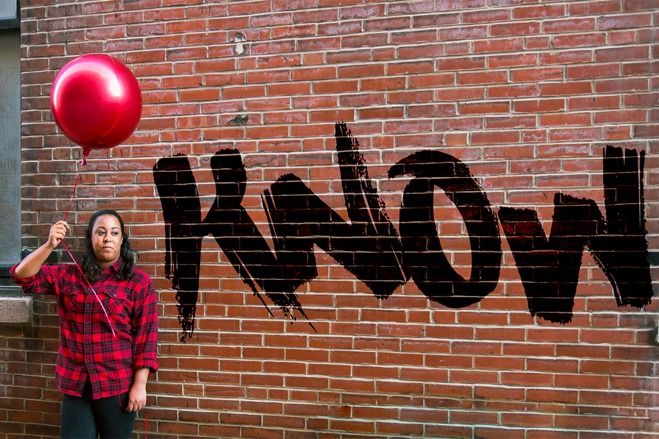 Young woman holds a red balloon, representing the I in I Know, an HIV testing awareness campaign sponsored by the Infectious Diseases Division of Washington University School of Medicine in St. Louis